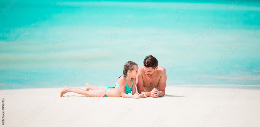 Panorama of father and his adorable little daughter at tropical beach Panorama of father and his adorable little daughter at tropical beach