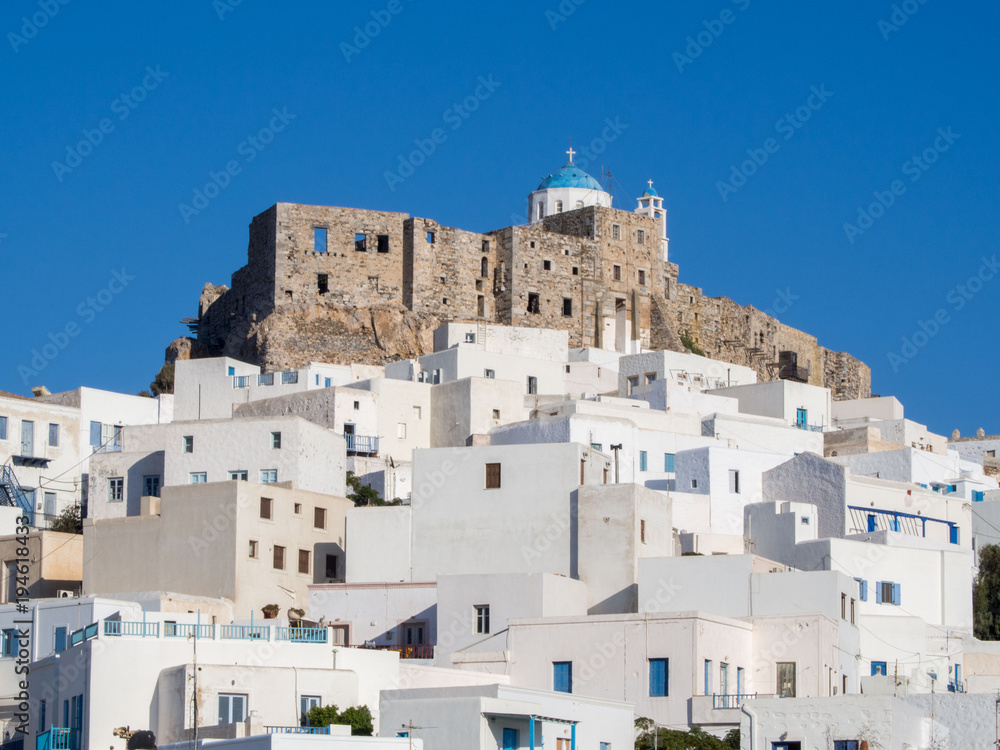 midday in Astypalaia ,Greece with a close up of the castle and the traditional white houses