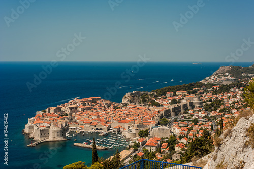 Fototapeta Naklejka Na Ścianę i Meble -  Spectacular picturesque view on the old town (medieval Ragusa) and Dalmatian Coast of Adriatic Sea. Picture taken from the mountain trails above Dubrovnik citadel, Famous European Travel Destination.