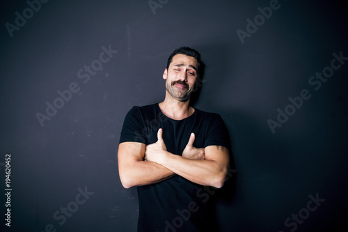 Young handsome man with beard and mustache studio portrait © EnginKorkmaz
