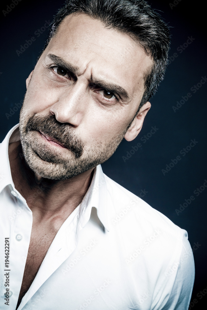 Young handsome man with beard and mustache studio portrait Young handsome man with beard and mustache studio portrait