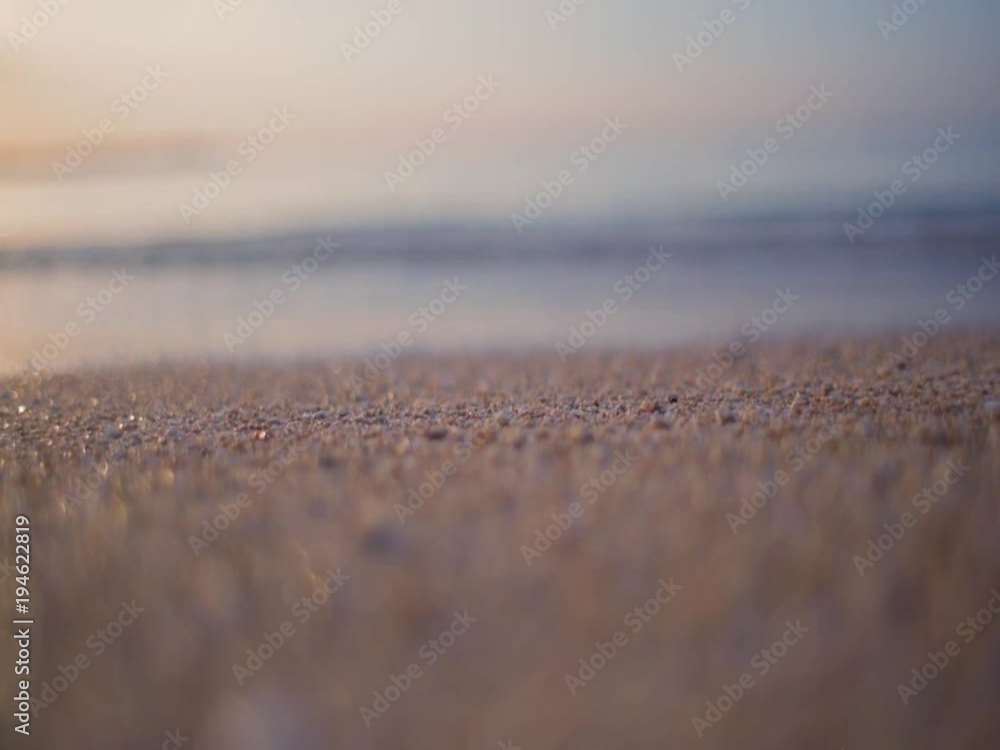 wave on the sand of bali beach close-up with shallow depth of field wave on the sand of bali beach close-up with shallow depth of field