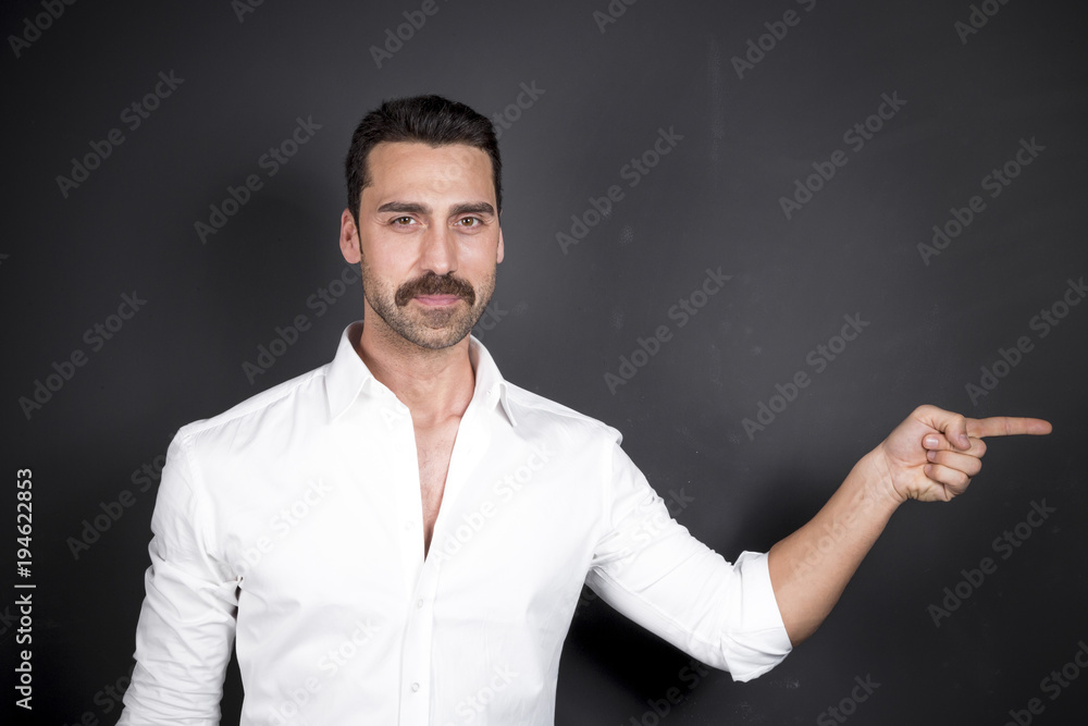 Young handsome man with beard and mustache studio portrait Young handsome man with beard and mustache studio portrait