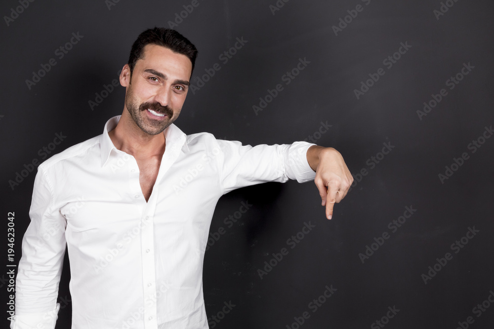 Young handsome man with beard and mustache studio portrait