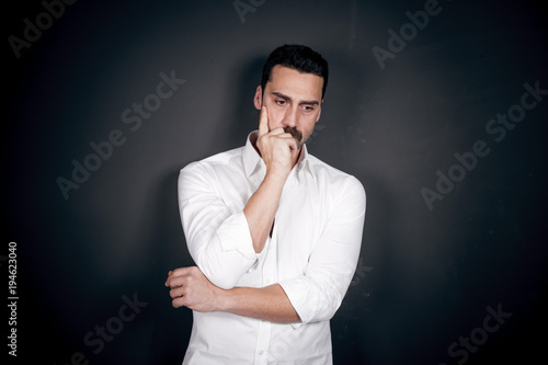 Young handsome man with beard and mustache studio portrait