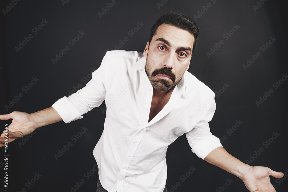 Young handsome man with beard and mustache studio portrait