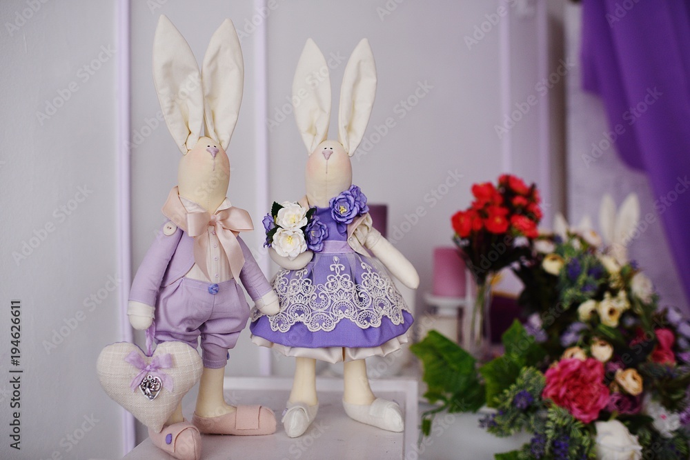 Obraz premium family of Easter Bunny close-up on a background of flowers