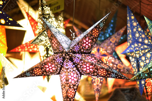 Christmas stars hanging on a stall