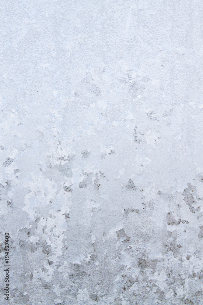 Winter frosty patterns on the frozen ice window Winter frosty patterns on the frozen ice window