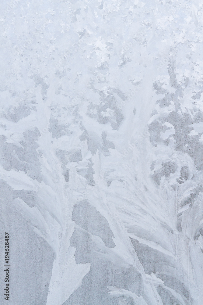 Winter frosty patterns on the frozen ice window Winter frosty patterns on the frozen ice window