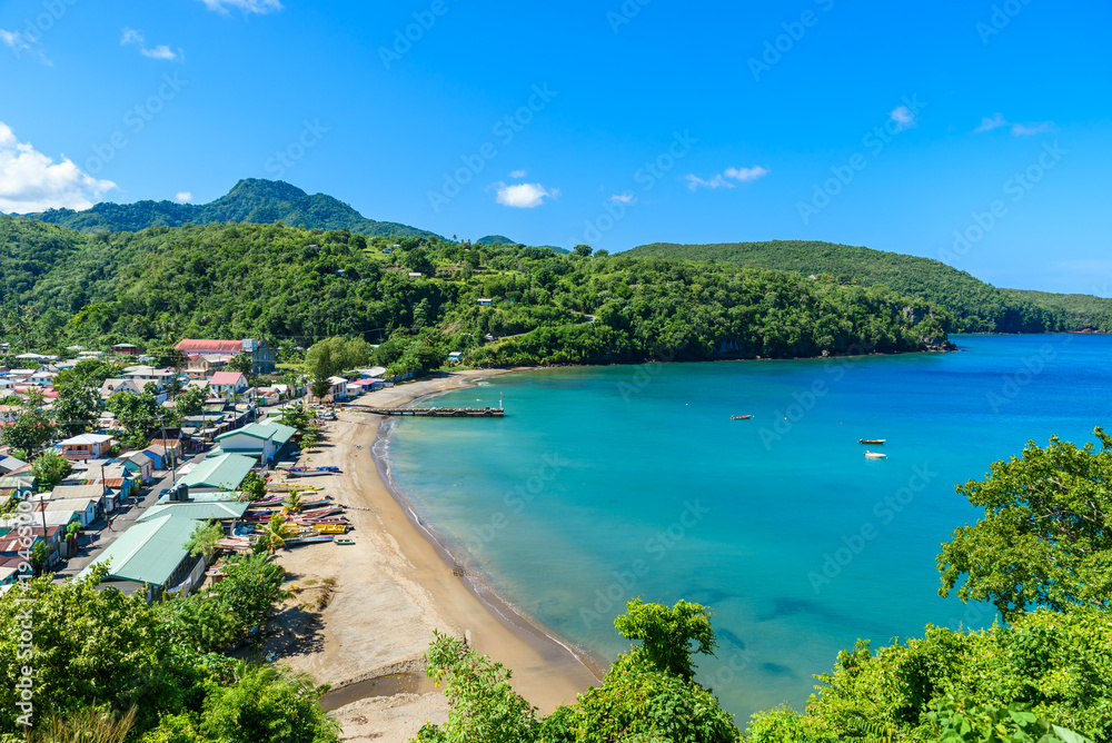 Fototapeta premium Anse la Raye - tropical beach on the Caribbean island of St. Lucia. It is a paradise destination with a white sand beach and turquoiuse sea.