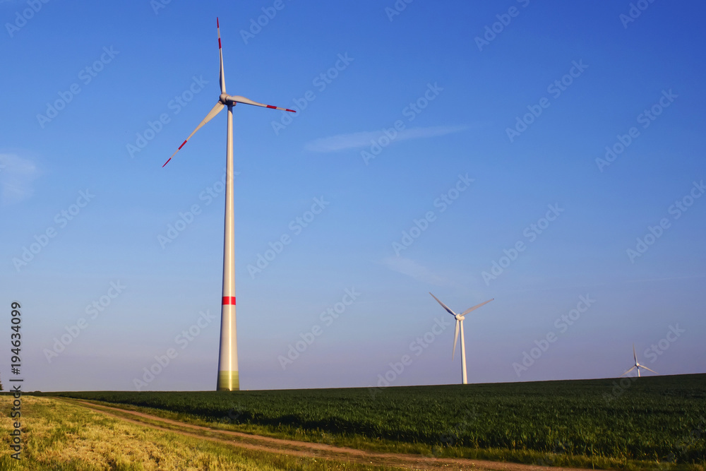 Wind turbines produce environmentally friendly alternative energy without destroying nature. Wind turbines produce environmentally friendly alternative energy without destroying nature.