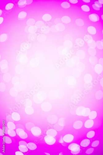Pink Festive Christmas background. Abstract background with blur lights and stars