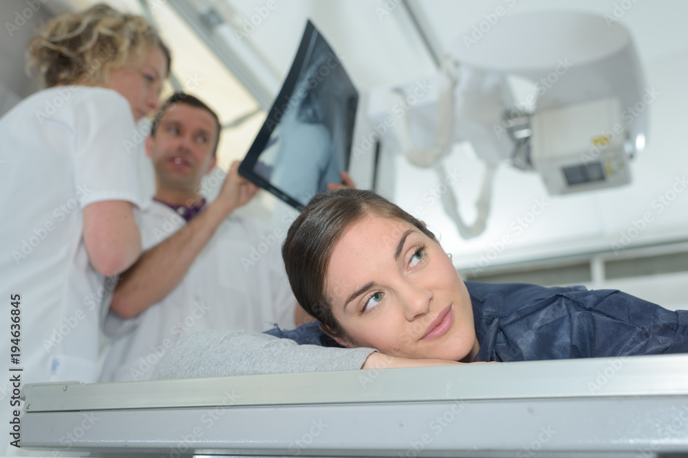 doctors talking about patient xray in hospital doctors talking about patient xray in hospital