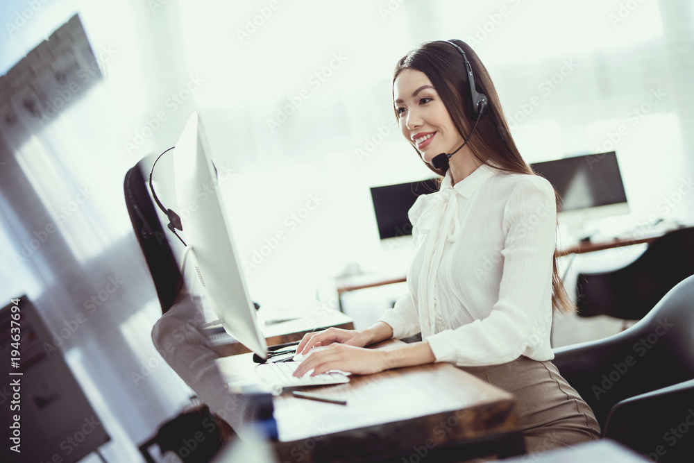 Asian girl sitting in the call center. Asian girl sitting in the call center.
