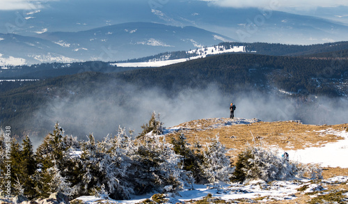 Having fun on a sunny day of winter on Hasmas mountains in Romania. photo