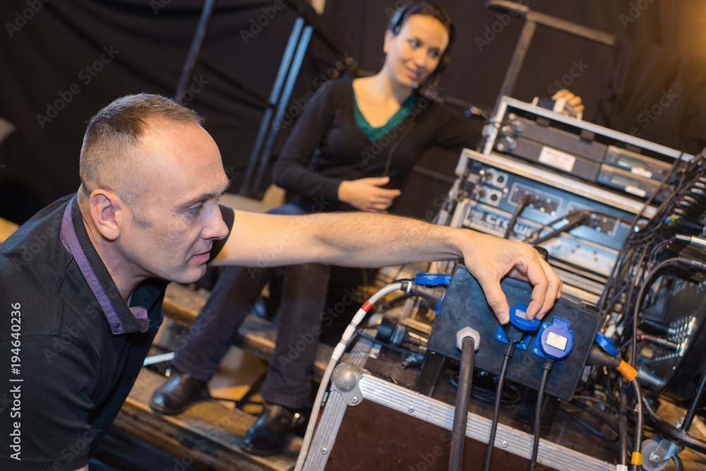 music producer working on digital studio mixer for tv programme