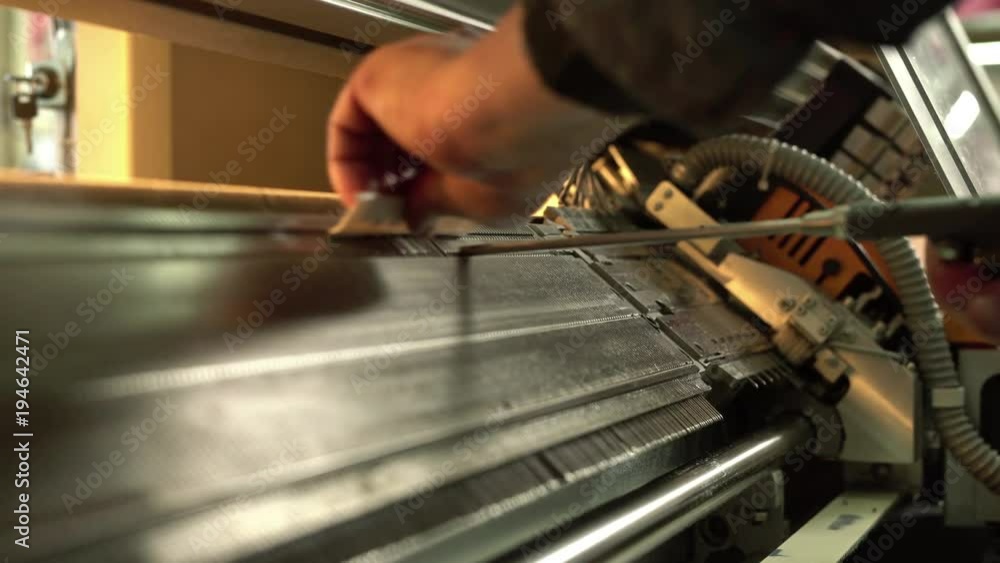 Serviceman setting up the knitting machine video Serviceman setting up the knitting machine video