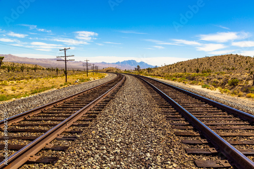 Railroad tracks going through Mojave Desert in California