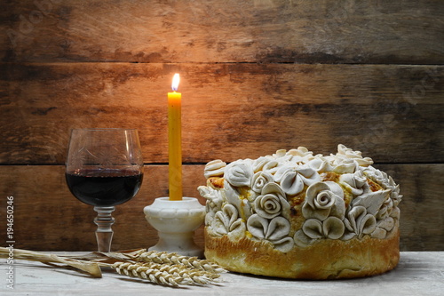 Homemade decorated Serbian slava bread with red wine