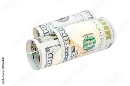 Rolled up dollar bill on white background. Business concept.