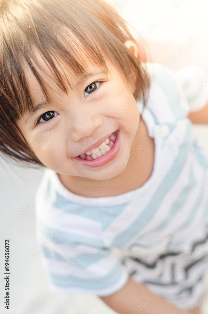 Happy little asian girl smiling play with sand Happy little asian girl smiling play with sand