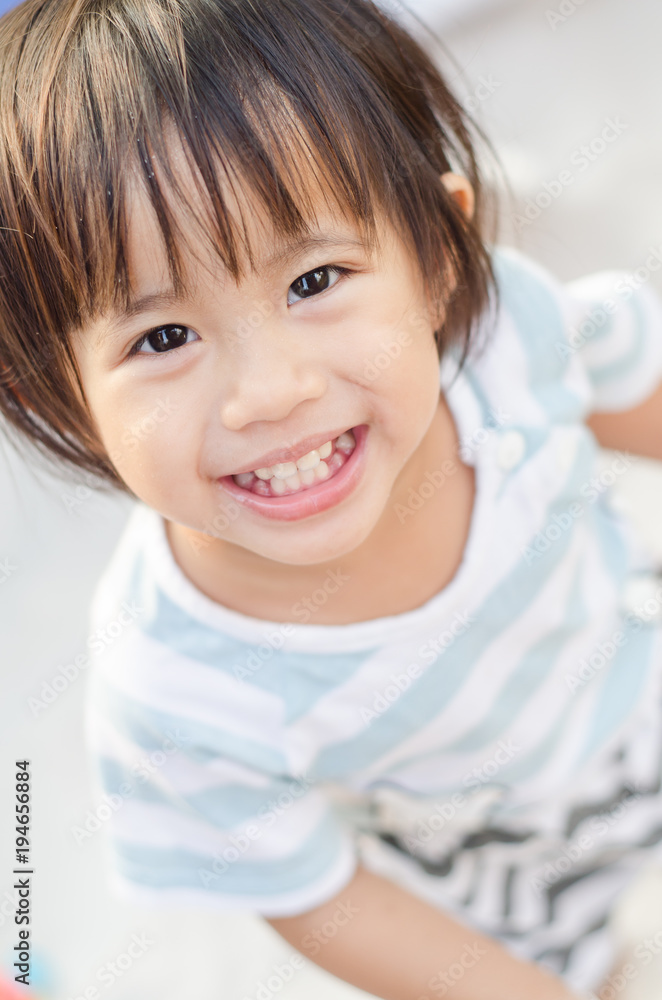 Happy little asian girl smiling play with sand Happy little asian girl smiling play with sand