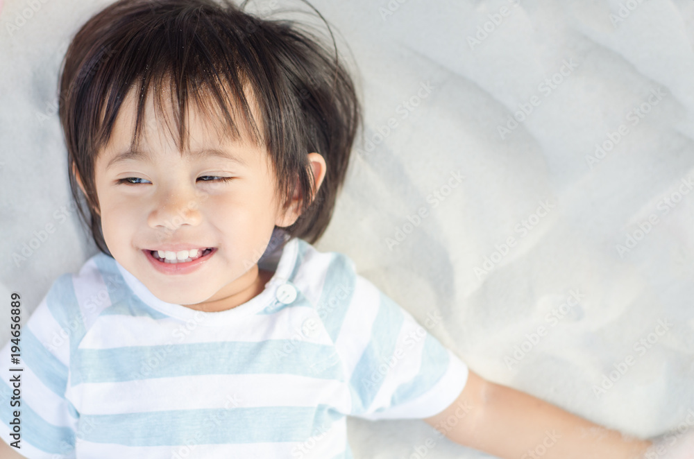 Happy little asian girl smiling play with sand Happy little asian girl smiling play with sand