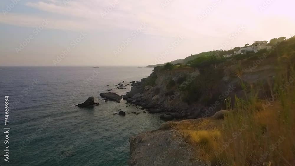 enjoy this 4k aerial view of crete beach at day and sunset