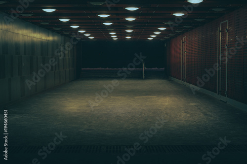 Central marketplace at night time. Isolated territory filled with trading stands and lighten by city lights. Spooky and abandoned atmosphere in urban market territory. 