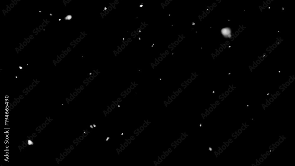 Snowflakes fall down on black background Snowflakes fall down on black background