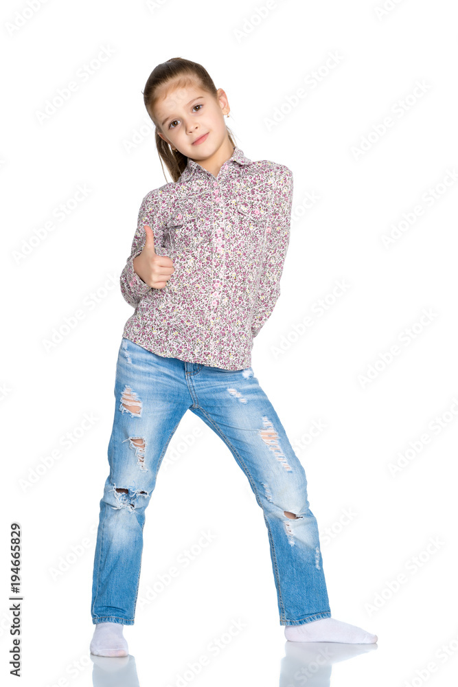 Fototapeta premium Little girl holding her thumb up