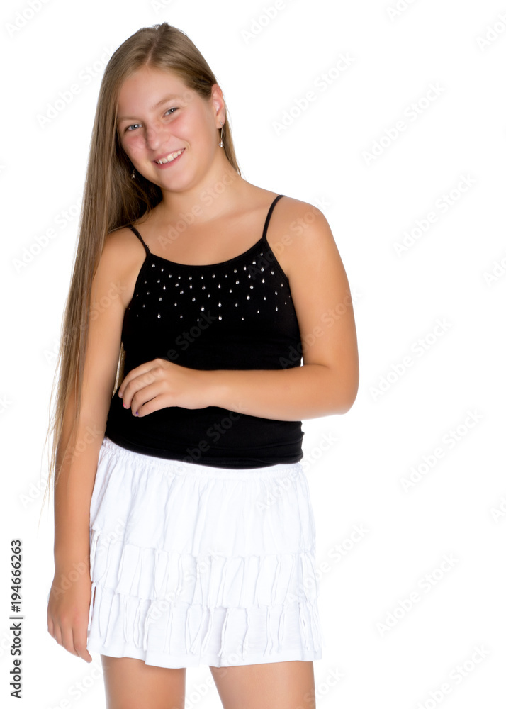 A teenage girl in a short dress. A teenage girl in a short dress.