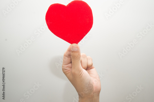 Female hand show up on white background, sign of love, love moment.