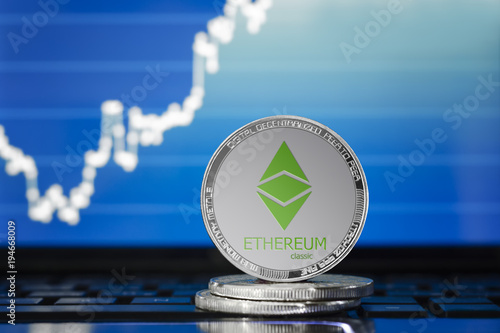 ETHEREUM classic (ETC) cryptocurrency; silver ethereum classic coin on the background of the chart