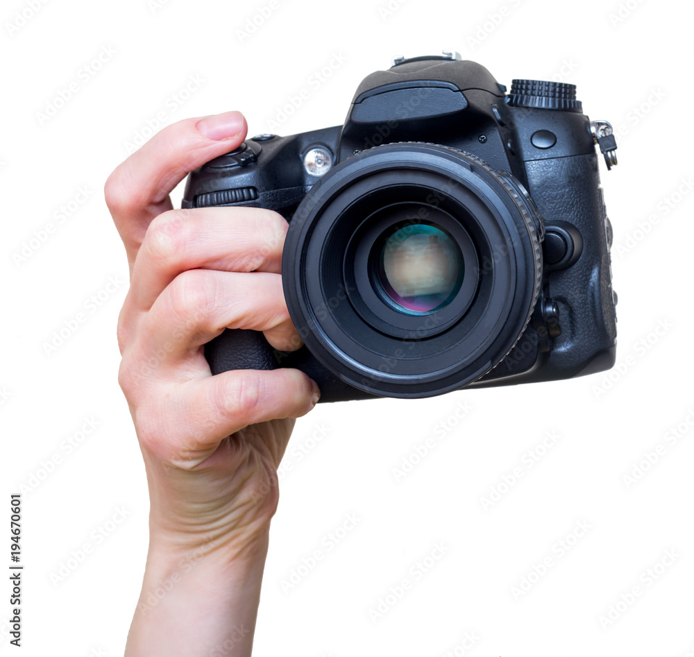 Female hand with modern DSLR camera with lens mounted. Photography equipment. Isolated on white. Female hand with modern DSLR camera with lens mounted. Photography equipment. Isolated on white.