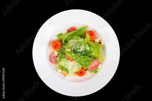 fresh vegetables salad with cheese on black background