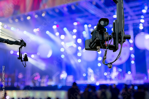 video camera on crane  covering event on stage