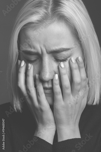 Portrait of a sad woman. Black and white. Close up