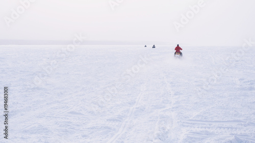 People in atv quad bike. Winter snow field