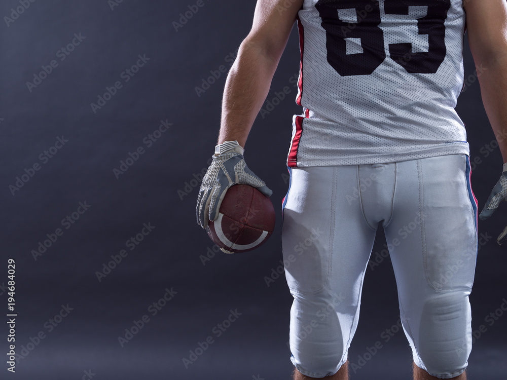 closeup American Football Player isolated on gray closeup American Football Player isolated on gray