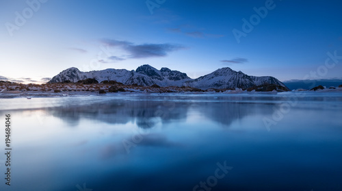 Mountain ridge and reflection in the lake. Natural landscape in the Norway