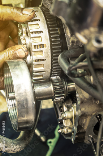 Part of motorcycle engine overhaul and technician repair.
