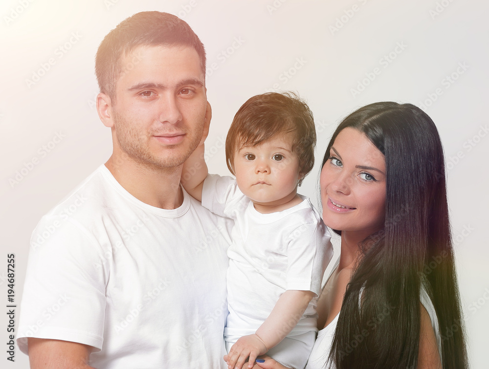 Happy family with newborn baby on a white background. Happy family with newborn baby on a white background.