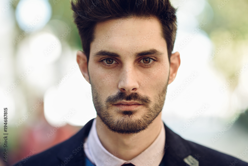 Close-up of attractive man in the street in formalwear. Close-up of attractive man in the street in formalwear.