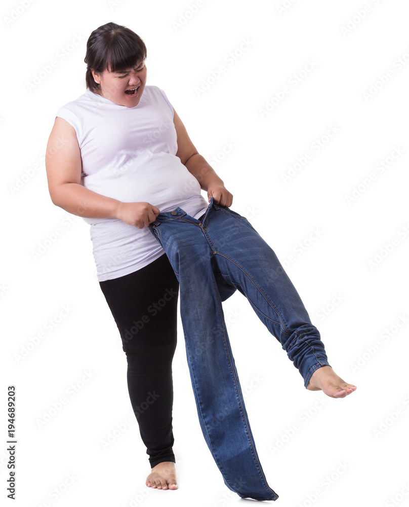 Fat asian woman trying to wear small size jeans isolated on white. Fat and  Healthcare concept Stock Photo | Adobe Stock