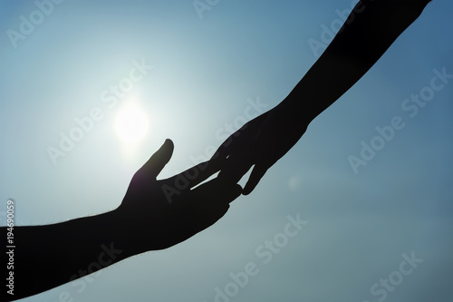 silhouette of helping hand concept and international day of peace. Support. international day of peace.friendship.help me