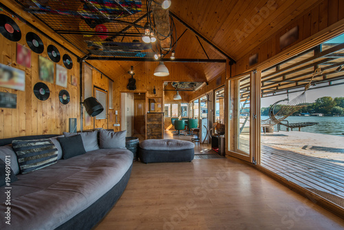 Fotografie Luxury log cabin house living room with large windows