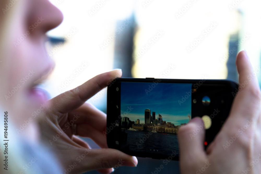 London city view in mobile phone, Corporate building in London City, England, UK