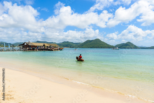 Pigeon Island Beach - tropical coast on the Caribbean island of St. Lucia. It is a paradise destination with a white sand beach and turquoiuse sea. © Simon Dannhauer